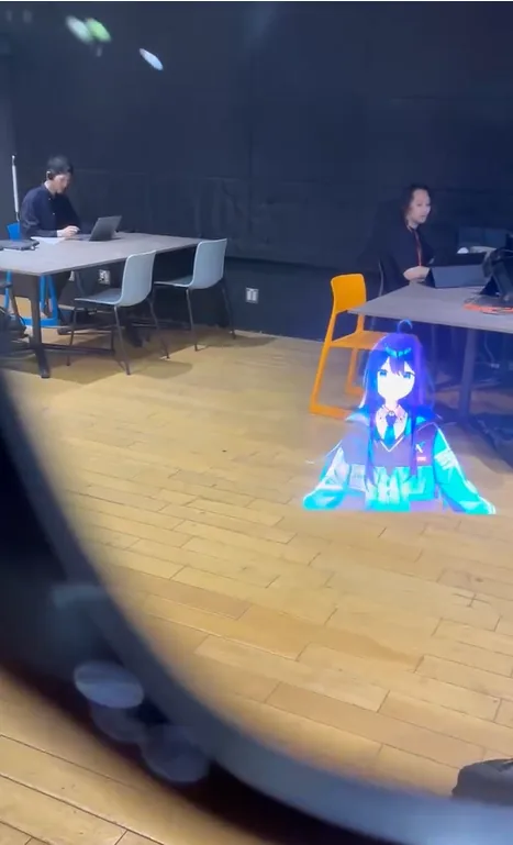 Alice standing on the floor of a room, photographed through the Ray-Ban Meta Display.